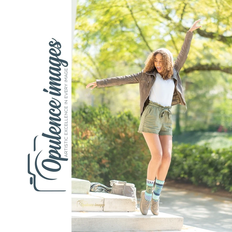 Claire Ofotokun (COFO) jumping on outdoor steps wearing colorful patterned socks, beside Opulence Images branding.